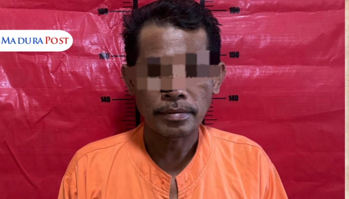 DITANGKAP. Moh. Sahnan, tersangka kasus kekerasan seksual terhadap santriwati di Pulau Kangean, saat diamankan oleh pihak kepolisian. (Istimewa for MaduraPost)